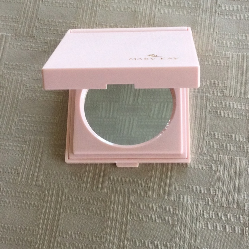 Mary Kay make up mirror in a tapestry holder. 3 3/4 X 3 in. Never been used.